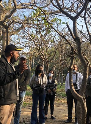 Visitors joining a guided walk through nature while learning about wildlife and surroundings.
