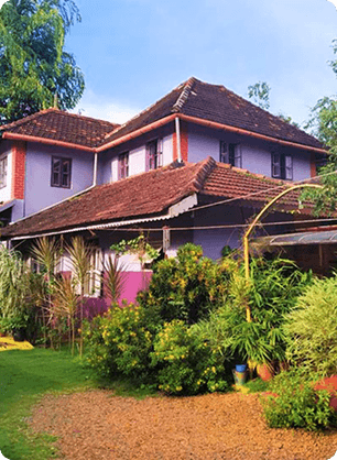 Traditional Homestay Surrounded by Garden and Local Charm Peaceful homestay with tiled roof and garden space reflecting local culture and warm hospitality